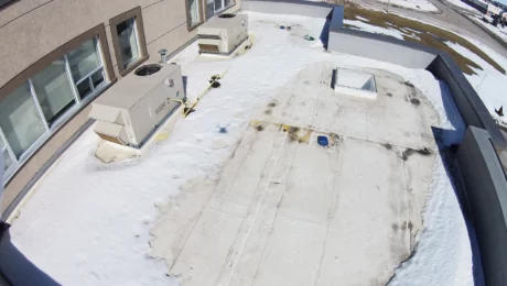 winter-roof-maintenance Winter Tips for Commercial Flat Roofs